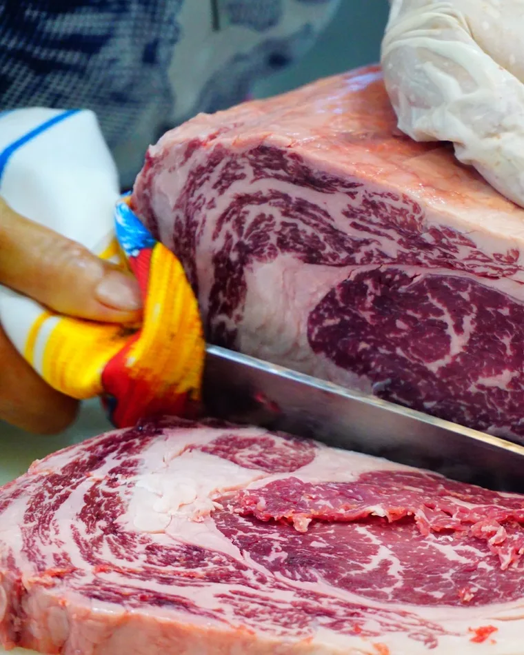 Whole cube roll, raw, showing the cut and its marbling